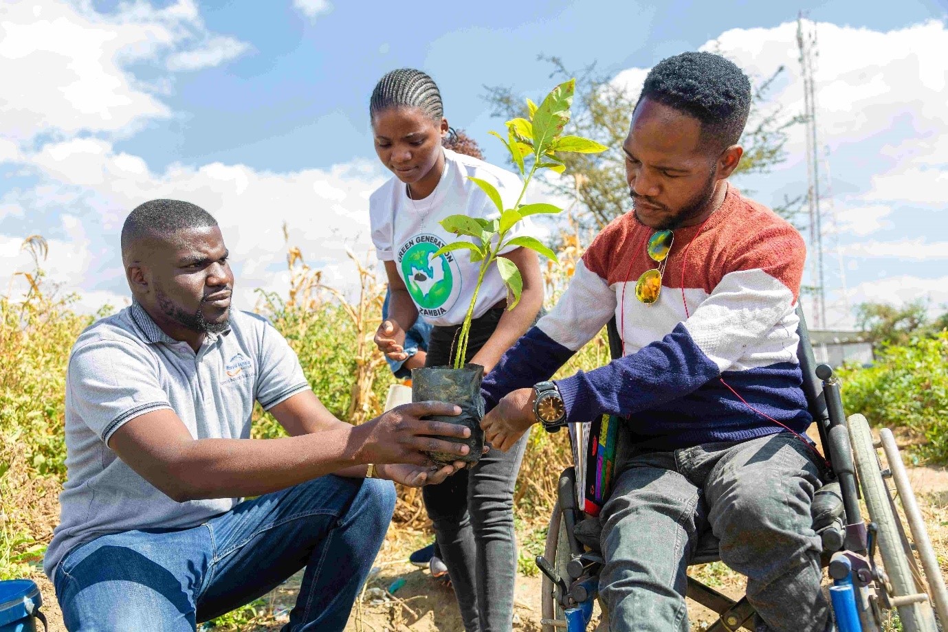 Asst. Executive Director, Oze Makukula and Mwelwa Chileshe of Green Generation Zambia and Andries Haadebe, Director of Rising Above Disabilities during a tree planting exercise in Chawama, Zambia